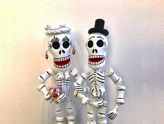 Two skeleton figures. Photo.